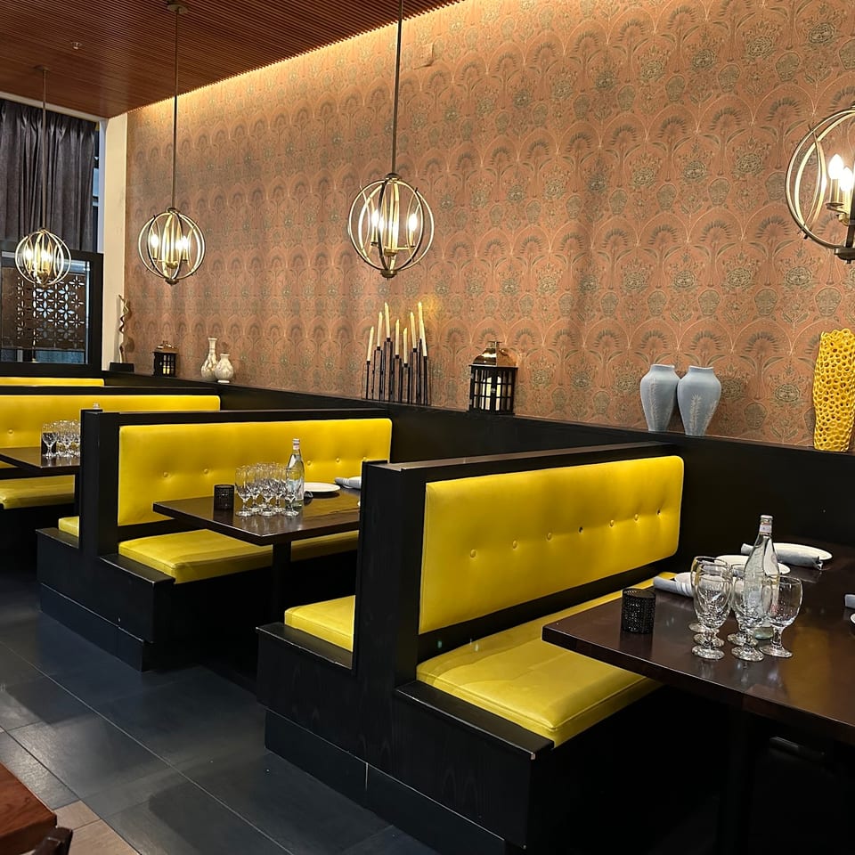 Signature yellow booth seating inside The Yellow Chilli Danville